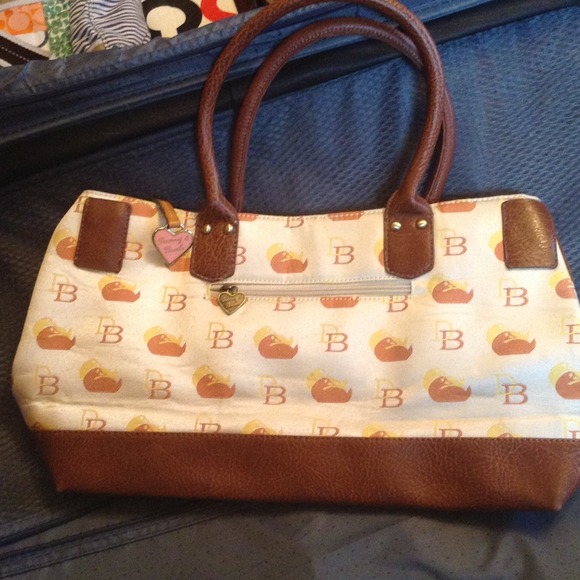 Dooney and Bourke.....offer? Can be used as diaper