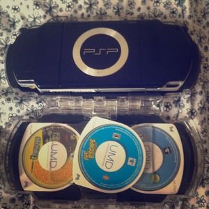 PSP with 3 games and a case.