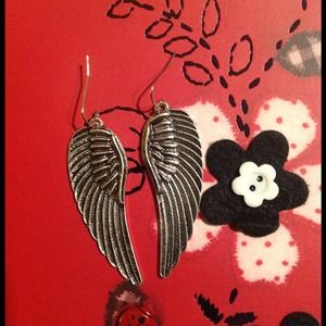 Brand new angel wing earrings.
