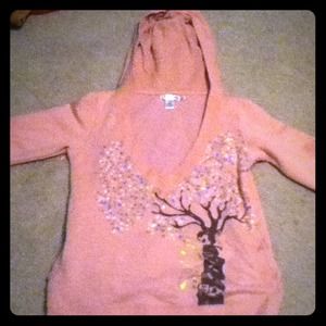 Unique pink/peach colored girly hoodie.
