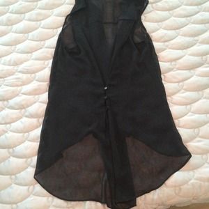 Sheer black highlow top with buttons down back.