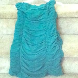Green strapless dress.