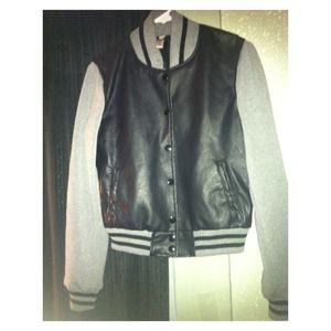 Leather jacket with sweater sleeves