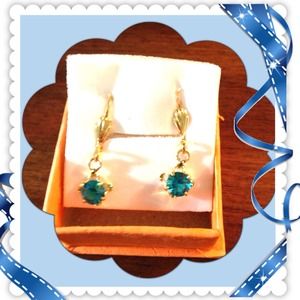 Gold tone Dangling earring  with  blue stone