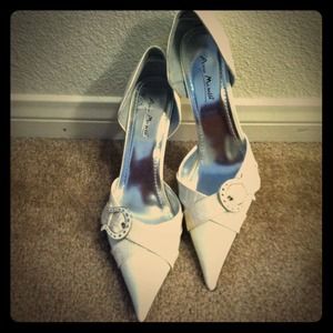 Ivory color high heeled shoes. Never worn!