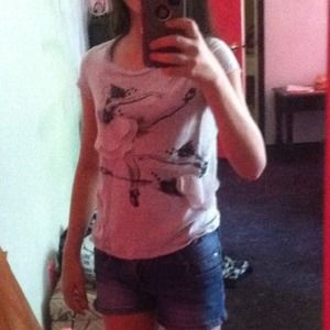 Grey frilly ballerina T-shirt.