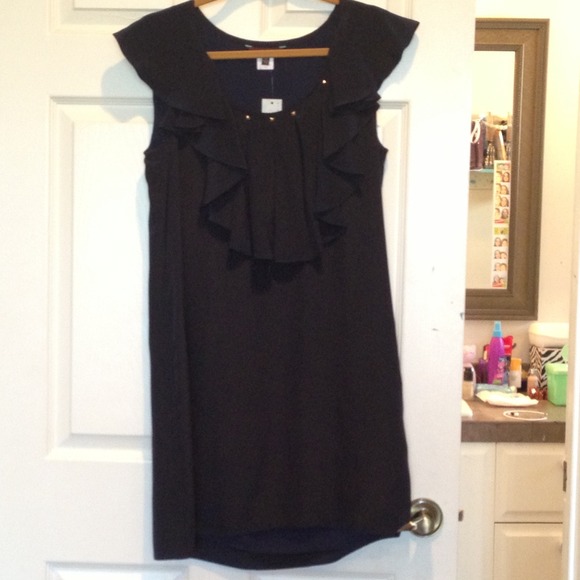 Navy blue, ruffled dress with studs above ruffles.