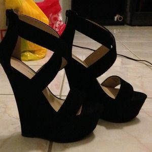Size 5.5 wedge heels from just fab. Brand new