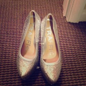 Shiny silver pumps