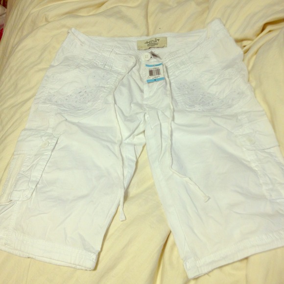 All white American Rag Bermuda shorts