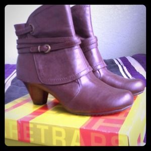 Brown ankle boots with buckled designs!