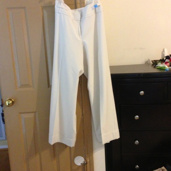 White pants with wide leg cuffs