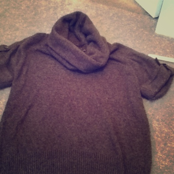 Brown cowl neck sweater.