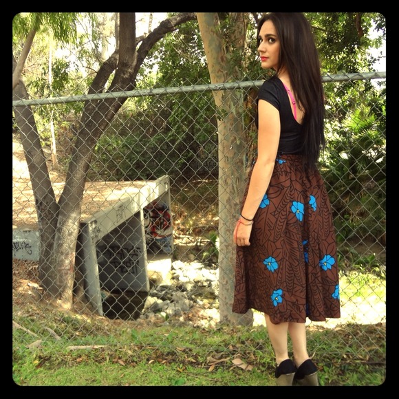 Vintage bown rayon skirt with blue flowers.
