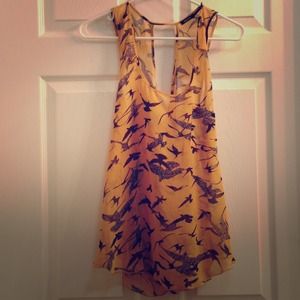 Sheer open back tank top.