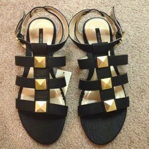 Sandals , size 7 black an gold !