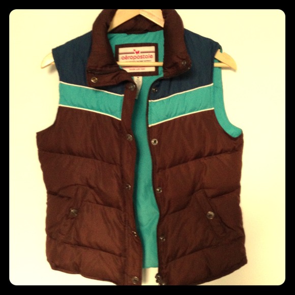 Brown puffer vest with blue and turquoise stripes