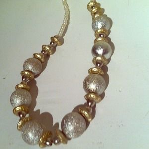 Silver, gold, and pearl necklace