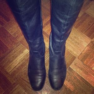 Black leather riding boots. Hit just under knee..