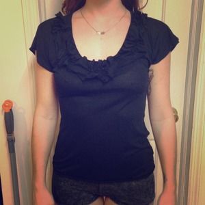 Black frilly dress shirt.