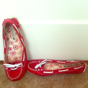 Red flats with white pleather accent ties