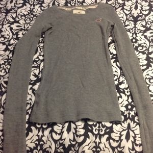Tight gray long sleeve.