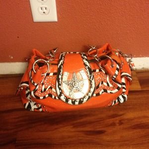 I'm selling a bright orange cowboy purse