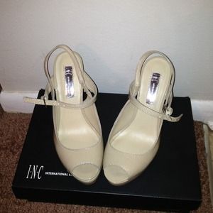 Nude pumps ankle strap.