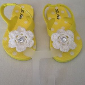 Yellow baby flip flops