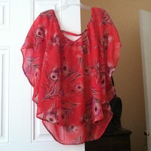 Orange peacock feather shirt.