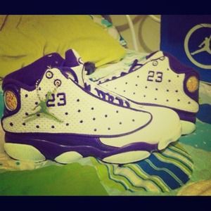 Purple and white girls Jordan 13s