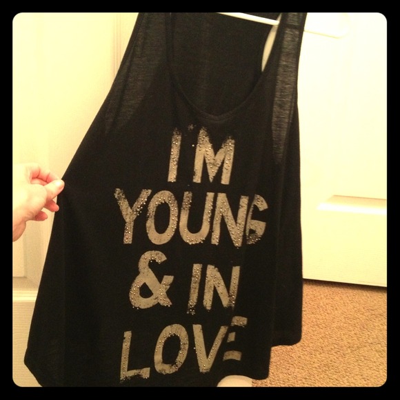 A black flowy tank. With "I'm young & in love"