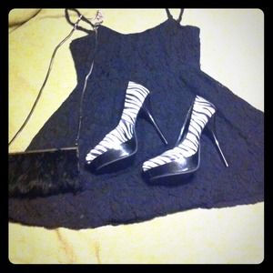 Sold! Black and white zebra print 5 inch heels.