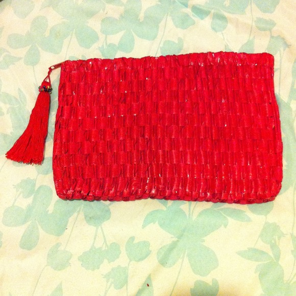 Red clutch, paper like material.