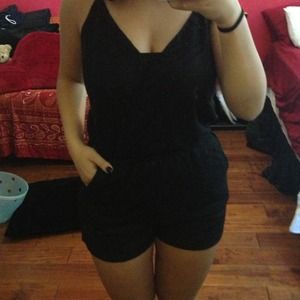 Black crochet romper. NEVER WORN!