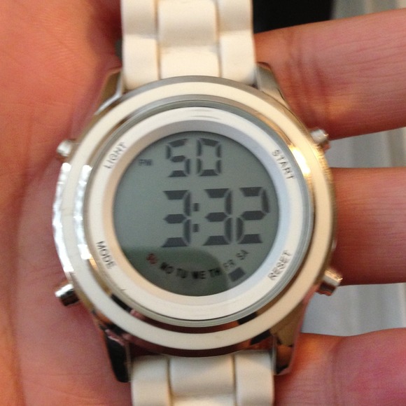 White watch with a rubber band a digital face