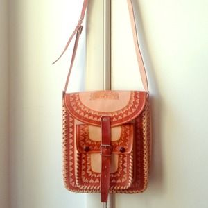 Embossed leather cross body saddle bag