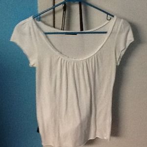 White top with ruffles in the front