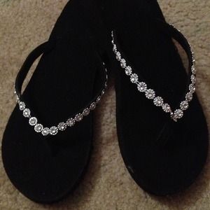 Black studded flip flops