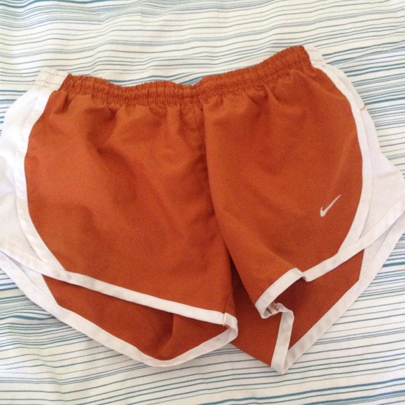 Burnt orange nike shorts.