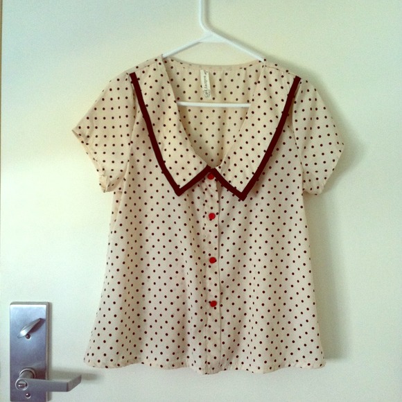 Cream colored top with polka dots