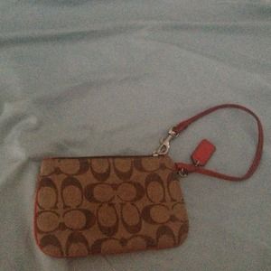 Orange/ tan coach zipper clutch