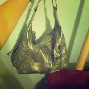 Silver metallic purse with tassels