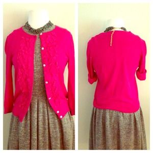Bright pink embellished cardigan.