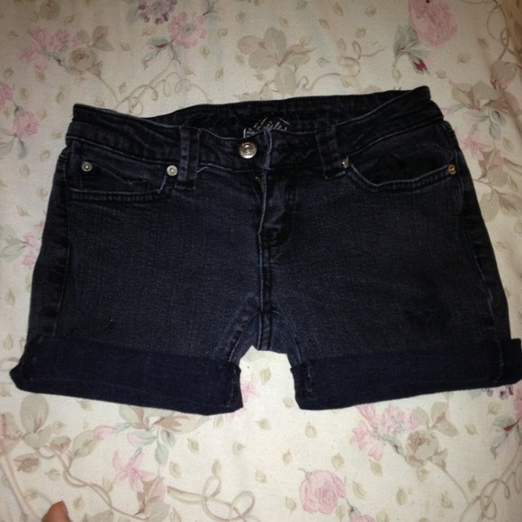 Cutoff black shorts.