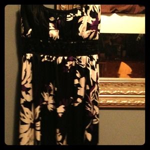 A purple, black and white sequined party dress.
