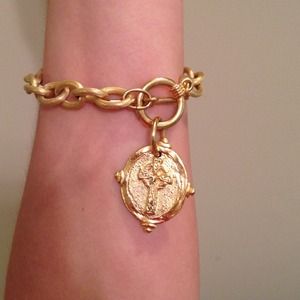 Gently used gold link bracelet with cross charm!