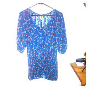 Bee Stitched brand sheer blue floral top.