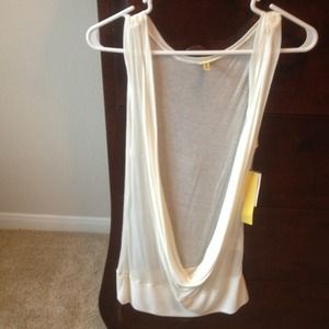 A cream frontless blouse.