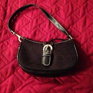 Small black purse. 6" long x 3" tall.